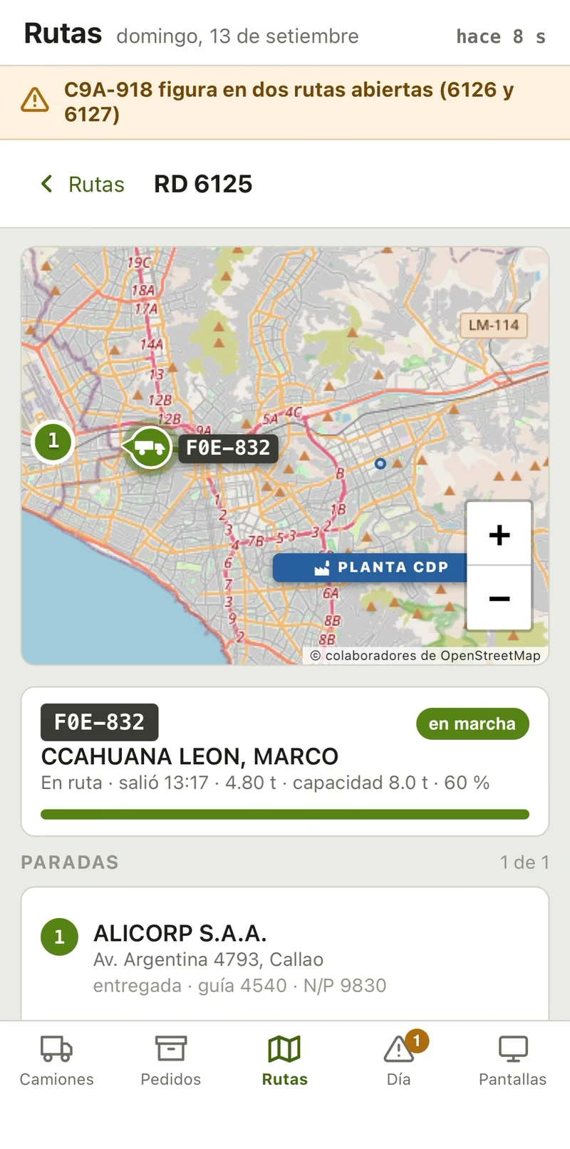 The dispatch board on a phone, one route: its truck on the map of Lima between the plant and its stop, the driver, the load and the share of capacity used, and the stop, Alicorp in Callao, delivered
