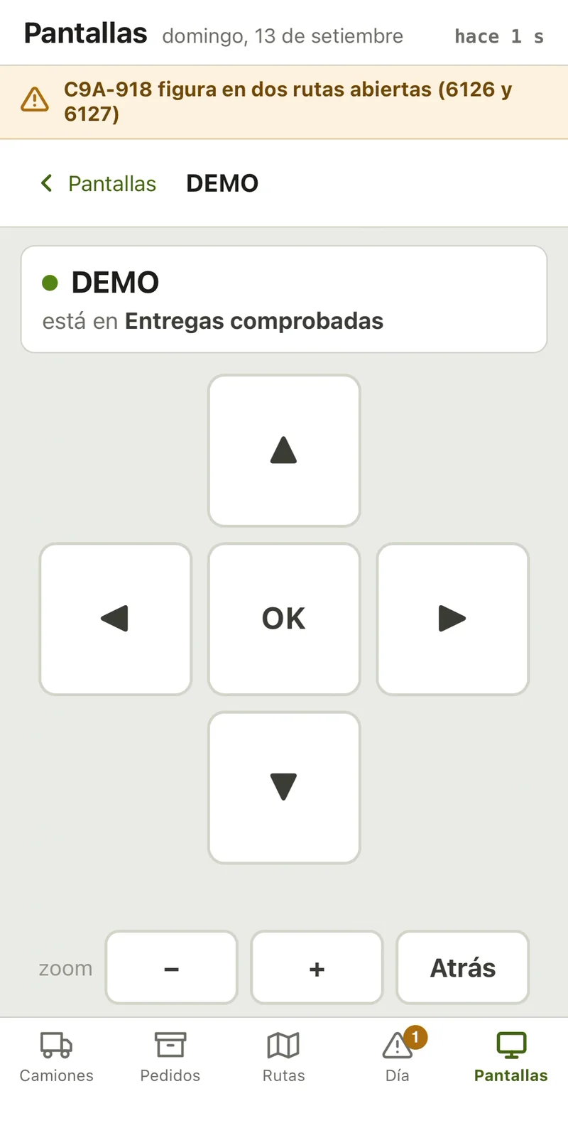 The phone as a remote for the wall screen named DEMO, which is showing Entregas comprobadas: arrow keys, OK, zoom and Atrás